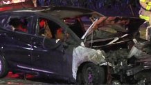 A car could be seen with bullet holes and apparently burned at 199th Street and Northwest 37th Avenue.
