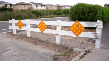 A county spokesperson says a white barricade like this one in Spring Valley will be installed in La Mesa on Fuerte Drive,